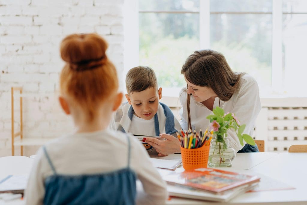 Photo of tutor working with elementary students in Greensboro, NC